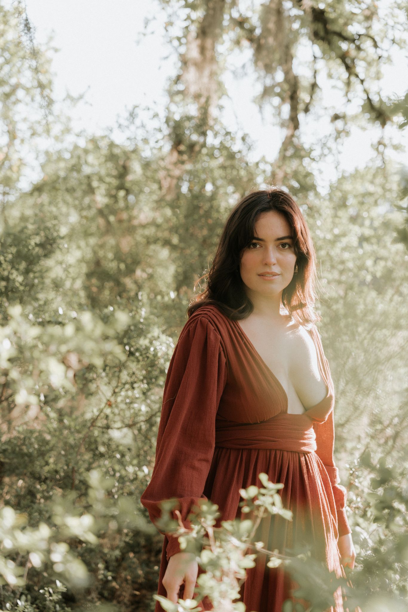 Portrait in a wine-red dress, soft sunlight
